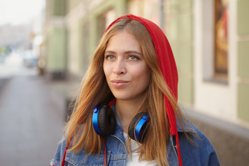 Beautiful white lady walks in city center.