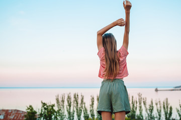 Kid on vacation on white rock background