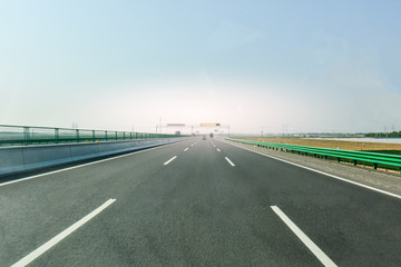 Fototapeta premium A view of the highway taken from a moving car