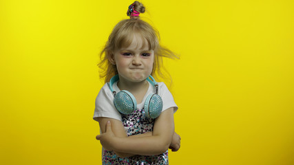 Bored lazy child crossed her arms, listening to boring story, not interested in communication