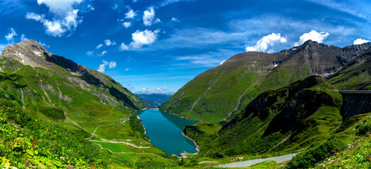 Naklejka na ściany i meble Panorama of the Kaprun Dam, a hydroelectric power station in the Austrian Alps