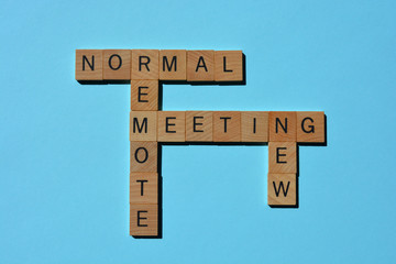 Fototapeta premium New Normal, Remote, Meeting, words, in wooden alphabet letters in crossword form isolated on blue