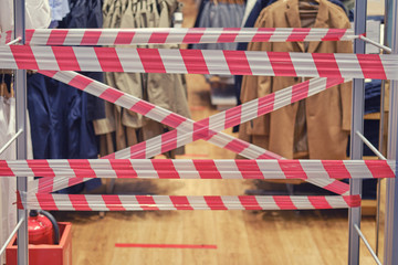 Fototapeta na wymiar Closed clothing store due to the coronavirus crisis