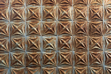 Full-screen texture of rusty metal decorative relief tiles