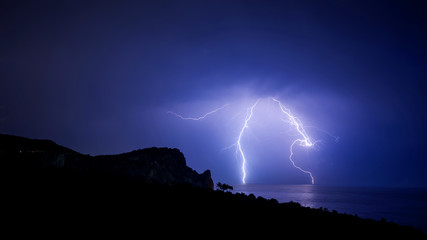 Naklejka na ściany i meble Complex shape lightning over the Black sea coast in Crimea, panoramic