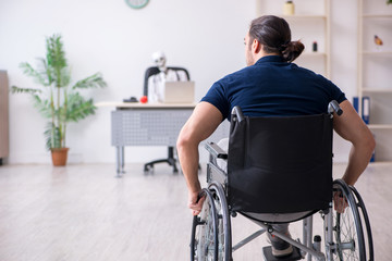 Young man in wheel-chair visiting dead doctor