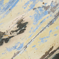 wooden surface with traces of blue and dark paint