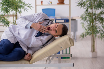 Young male doctor working in the clinic