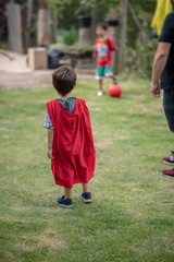 Obraz premium Little boy acting like a superhero