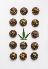 CBD chocolate infused with cannabis and cool coloured cocoa butter design.