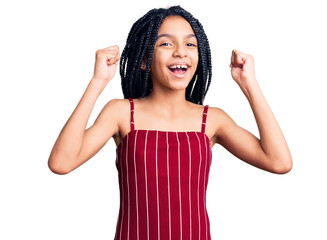 Cute african american girl wearing casual clothes screaming proud, celebrating victory and success very excited with raised arms