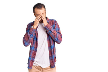 Young handsome man wearing casual clothes rubbing eyes for fatigue and headache, sleepy and tired...