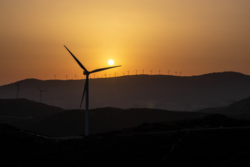 sunset with wind turbines