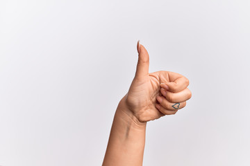 Hand of caucasian young woman doing successful approval gesture with thumbs up, validation and...