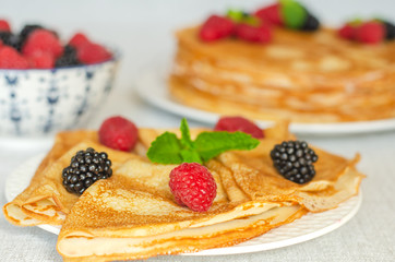 Crepes decorated with raspberries and blackberries