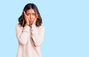 Young beautiful mixed race woman wearing winter turtleneck sweater tired hands covering face, depression and sadness, upset and irritated for problem