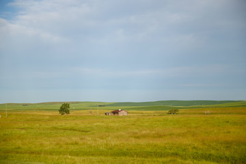 Fototapeta premium Farmland and highway scenes along the highways of Eastern Alberta Canada