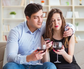 Young pair drinking wine in romantic concept