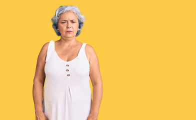 Senior woman with gray hair wearing casual clothes depressed and worry for distress, crying angry and afraid. sad expression.