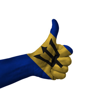 Hand making thumbs up sign, barbados painted with flag as symbol of thumbs up, like, okay, positive  - isolated on white background