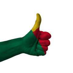Hand making thumbs up sign, benin painted with flag as symbol of thumbs up, like, okay, positive  -...