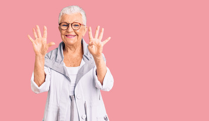 Senior beautiful woman with blue eyes and grey hair wearing casual clothes and glasses showing and pointing up with fingers number nine while smiling confident and happy.