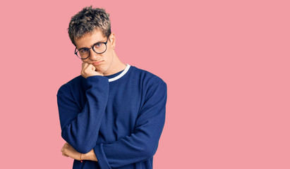 Young handsome man wearing casual clothes and glasses thinking looking tired and bored with depression problems with crossed arms.