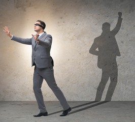 Fototapeta premium Businessman and his shadow in business concept