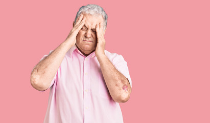 Senior grey-haired man wearing casual clothes suffering from headache desperate and stressed because pain and migraine. hands on head.