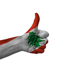 Hand making thumbs up sign, lebanon painted with flag as symbol of thumbs up, like, okay, positive ...