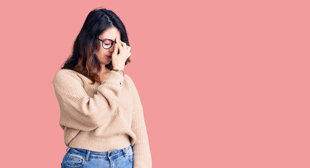 Beautiful young brunette woman wearing casual clothes and glasses tired rubbing nose and eyes...