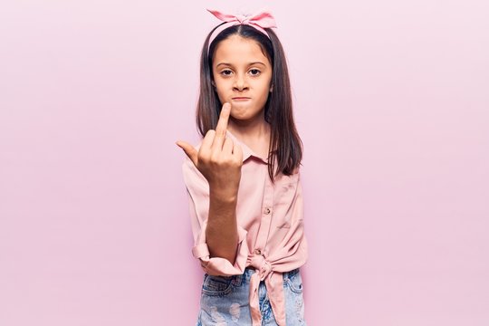 Beautiful Child Girl Wearing Casual Clothes Showing Middle Finger, Impolite And Rude Fuck Off Expression