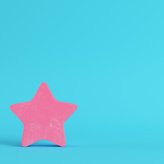 Pink abstract star on bright blue background in pastel colors