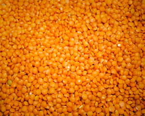 Red lentils background and texture