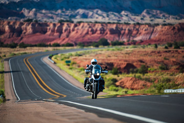 Motorbike on the road riding. Empty road on a motorcycle tour journey. Travel american concept.
