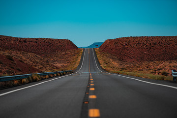 Landscape scene and sunrise above road. Endless straight.