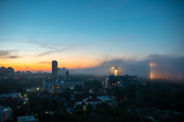 View of residential buildings at the sunset with cloudy sky.