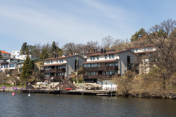 Fototapeta premium Typical buildings at Stockholm waterfront in a sunny day, Sweden.