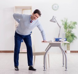 Employee suffering from backpain in office