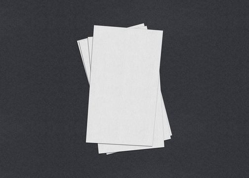 Blank white Business card mockup stacks on grey textured paper background. © shaadjutt36