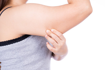 Woman holding excessive fat arm isolated on over white background. Woman pinching arm fat flabby skin. Weight loss, slim body, healthy lifestyle concept.