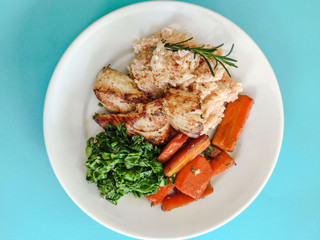 grilled chicken risotto carrots and vegetables meal
