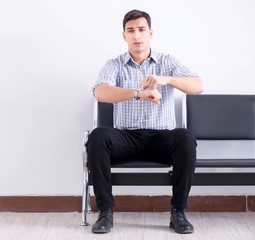 Man nervously impatiently waiting in the lobby