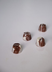 dark chocolate, milk chocolate and white chocolate bonbons. filled with peanut butter, dulce de leche, condensed milk and hazelnut cream