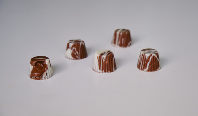 dark chocolate, milk chocolate and white chocolate bonbons. filled with peanut butter, dulce de leche, condensed milk and hazelnut cream