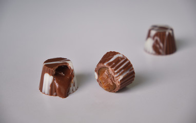 dark chocolate, milk chocolate and white chocolate bonbons. filled with peanut butter, dulce de leche, condensed milk and hazelnut cream