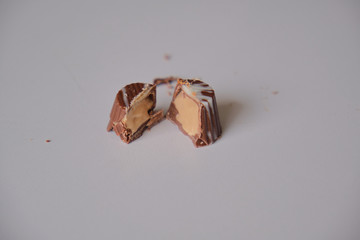 dark chocolate, milk chocolate and white chocolate bonbons. filled with peanut butter, dulce de leche, condensed milk and hazelnut cream