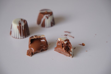 dark chocolate, milk chocolate and white chocolate bonbons. filled with peanut butter, dulce de leche, condensed milk and hazelnut cream