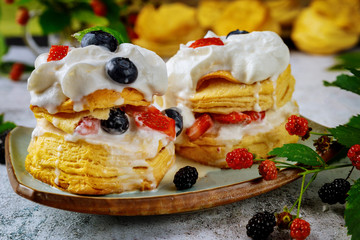 Southern british sweet dessert flaky biscuits with whipped cream and berries.