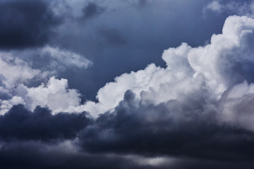 Fototapeta premium Dark thunderclouds in close-up. A background with dark clouds for design. 